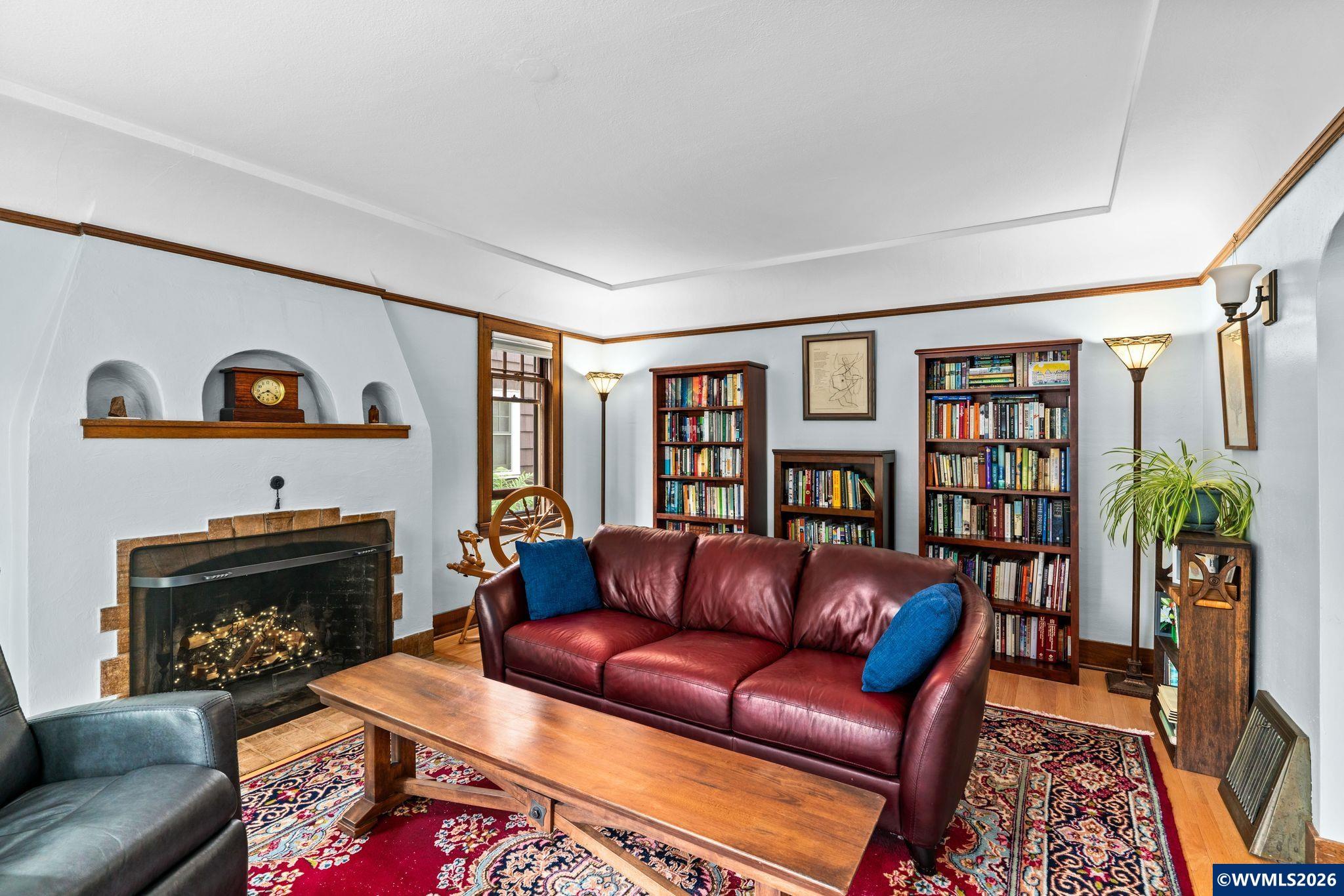 444 Northwest 35th Street Corvallis, OR 97330 - Photo 8 of 40 a living room with furniture fireplace and book shelf