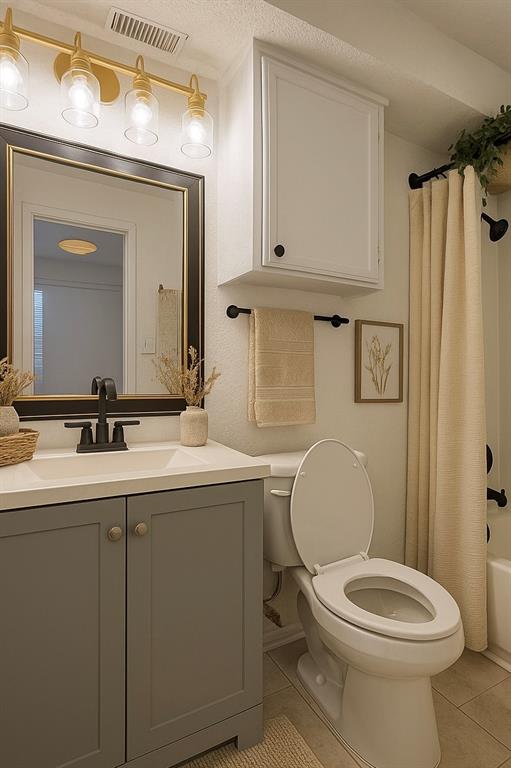 9813 Walnut Street, Unit 302 Dallas, TX 75243 - Photo 5 of 7 a bathroom with a toilet a sink and mirror