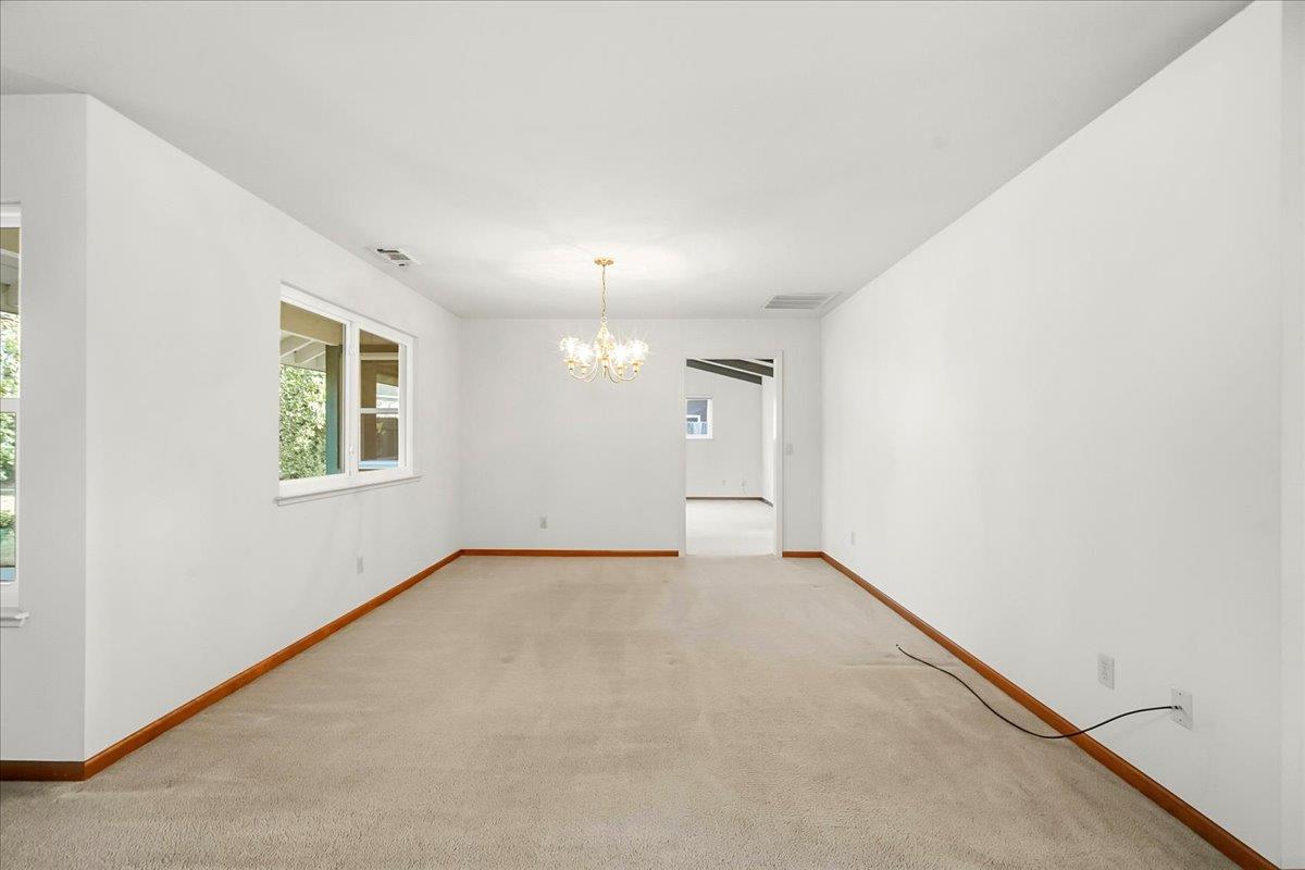 363 Diamond Oaks Road Roseville, CA 95678 - Photo 12 of 51 A formal dining room space with a backyard view is a design focal point that blends interior elegance with the natural landscape. Plenty of room for a larger table, chairs and buffet sideboard.