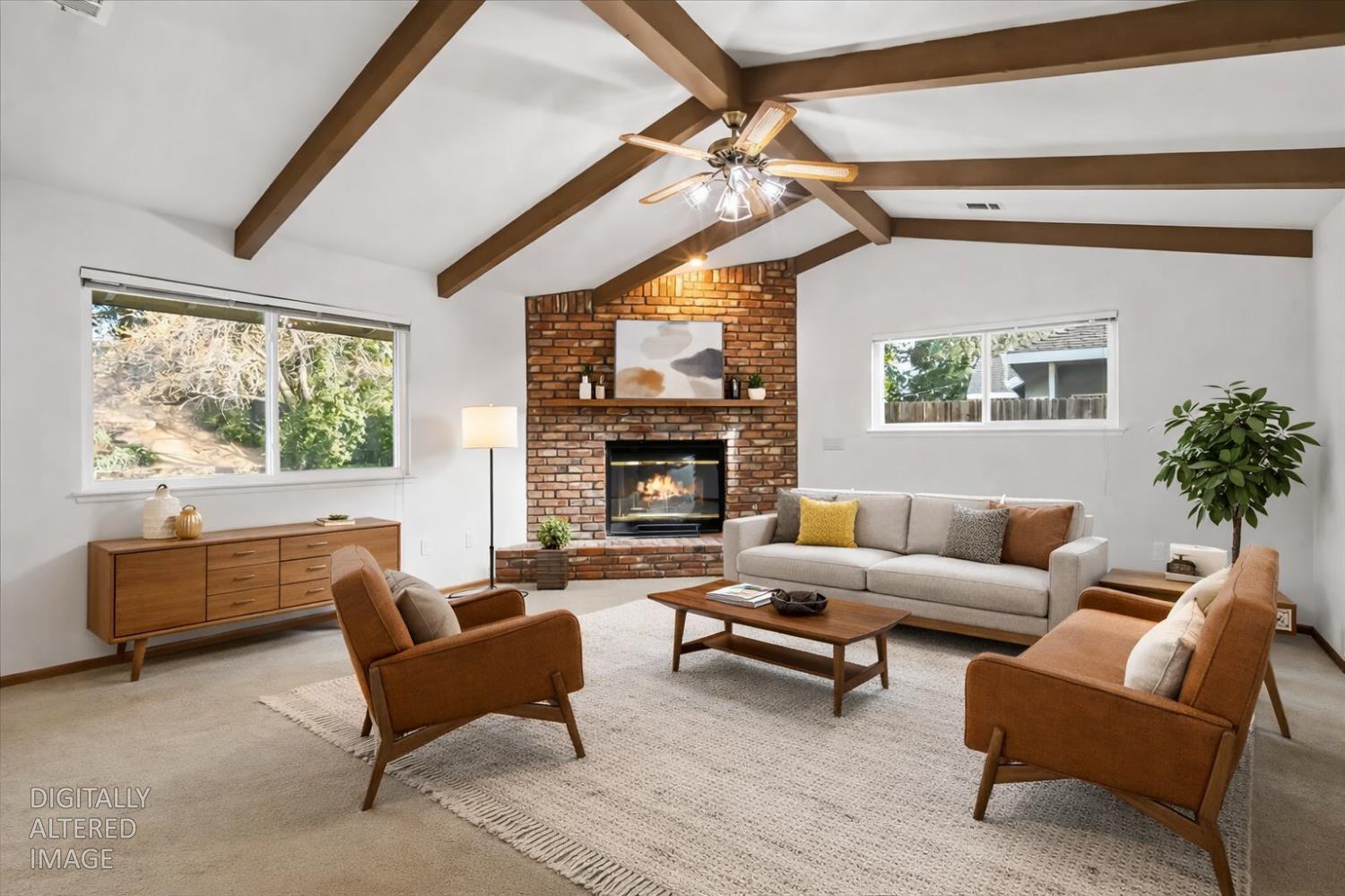 363 Diamond Oaks Road Roseville, CA 95678 - Photo 13 of 51 A separate family room featuring a raised hearth fireplace and wood beams creates a classic, cozy atmosphere that anchors the home for gatherings. Digitally altered photo showing furniture placement options.