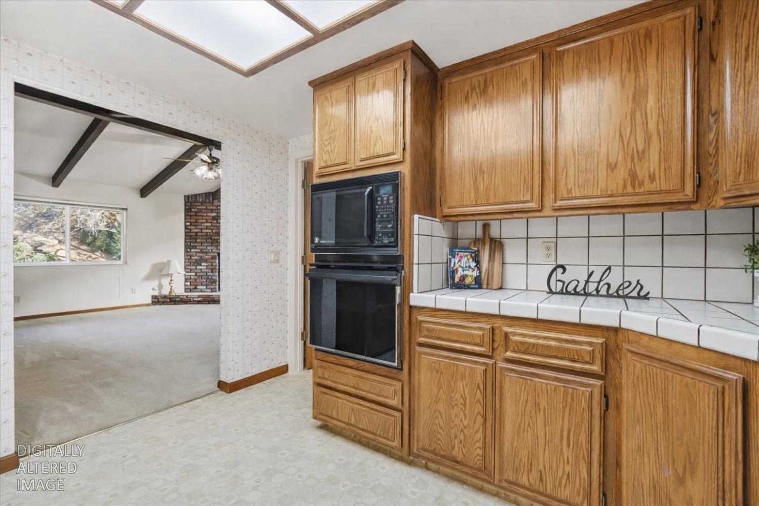 363 Diamond Oaks Road Roseville, CA 95678 - Photo 20 of 51 Kitchen with original classic layout - the ultimate blank canvas. Featuring wood cabinetry throughout. View from kitchen into the cozy Family room.