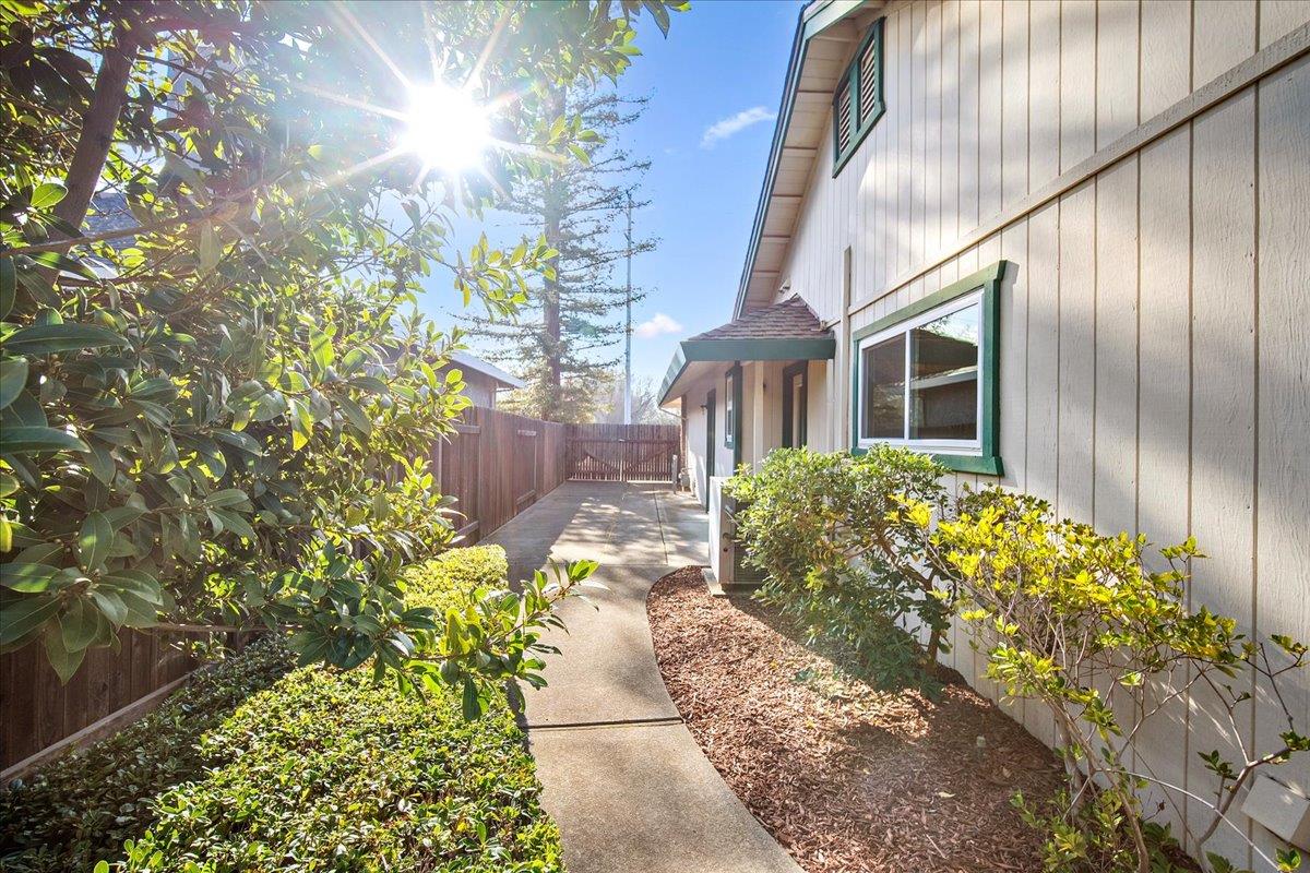 363 Diamond Oaks Road Roseville, CA 95678 - Photo 41 of 51 The Ultimate Decompression Zone: This high-utility side yard features an oversized gate and concrete pad, perfect for recreational storage. Designed for any lifestyle, a dedicated service entrance flows directly into the laundry/utility room and a full bath for effortless post-adventure cleanup, with a secondary door providing direct garage access.