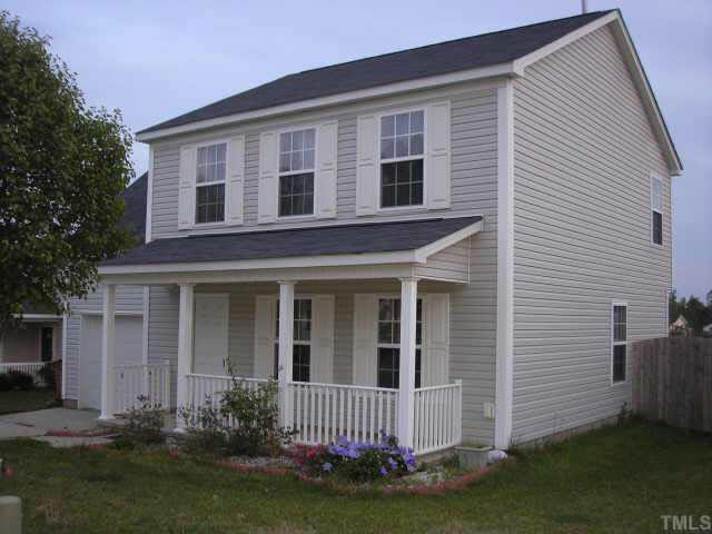 5704 Bryanstone Place Raleigh, NC 27610 - Photo 1 of 10 a front view of a house with a yard