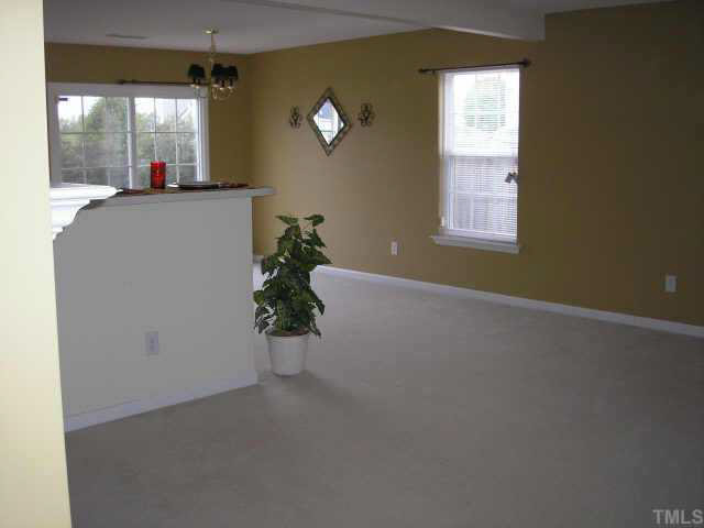 5704 Bryanstone Place Raleigh, NC 27610 - Photo 2 of 10 an empty room with windows and entrance