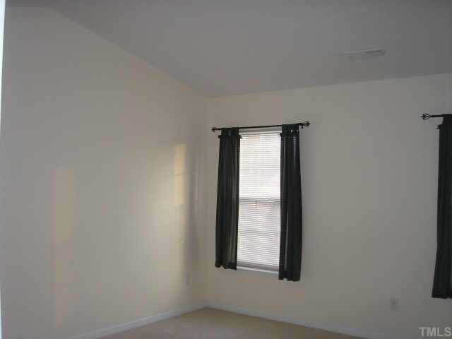 5704 Bryanstone Place Raleigh, NC 27610 - Photo 5 of 10 a view of an empty room and window