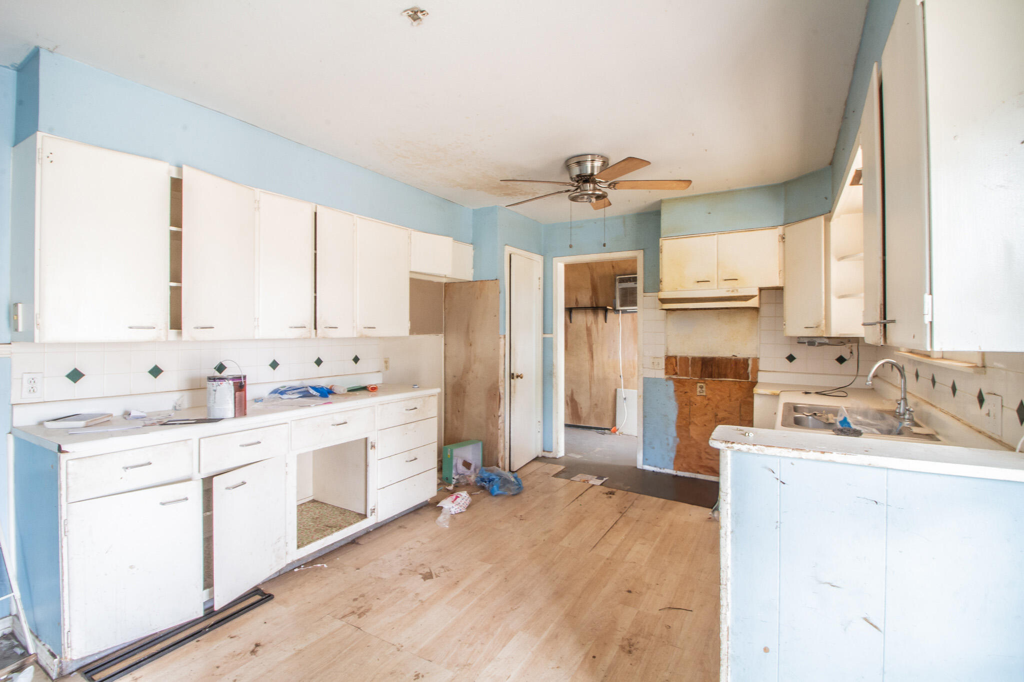 1606 60th Street Lubbock, TX 79412 - Photo 5 of 12 a kitchen with a sink stove and refrigerator