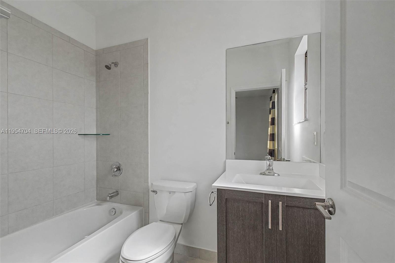 12947 Southwest 234th Street Homestead, FL 33032 - Photo 15 of 33 a bathroom with a sink toilet and shower