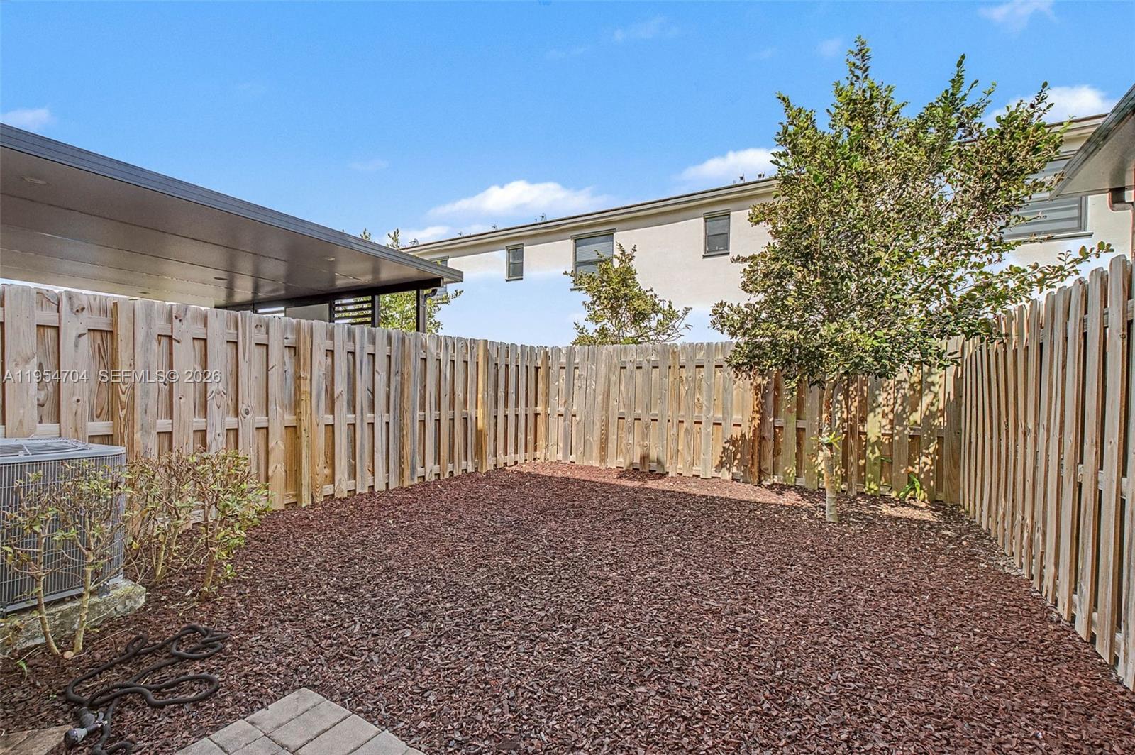 12947 Southwest 234th Street Homestead, FL 33032 - Photo 23 of 33 a view of backyard and tree