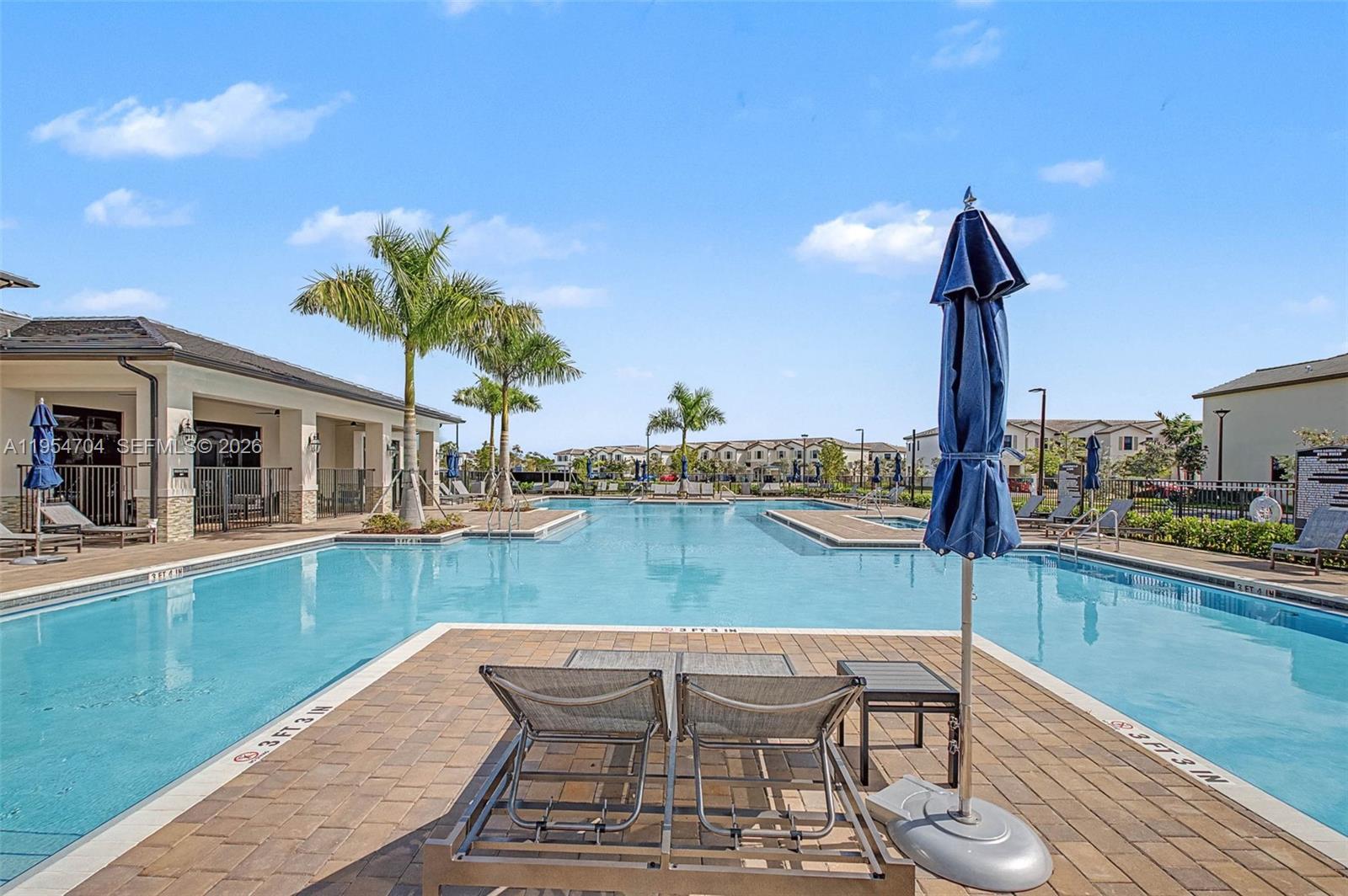 12947 Southwest 234th Street Homestead, FL 33032 - Photo 26 of 33 a view of a backyard with a patio and swimming pool