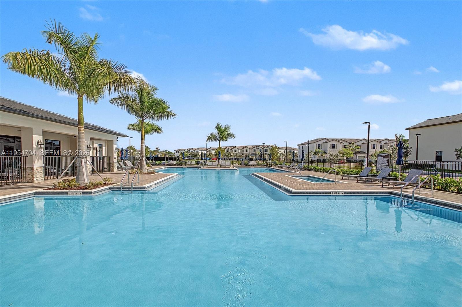 12947 Southwest 234th Street Homestead, FL 33032 - Photo 32 of 33 a view of a swimming pool and a chairs
