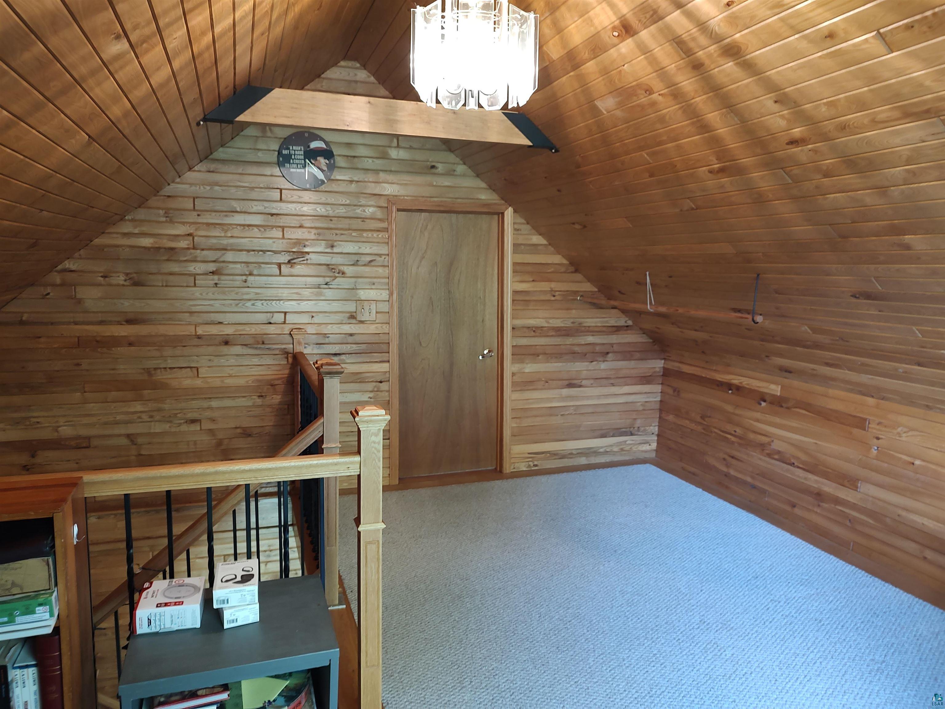 2585 Hautala Road Iron River, WI 54847 - Photo 11 of 28 Vaulted wood-paneled ceiling with an overhead chandelier