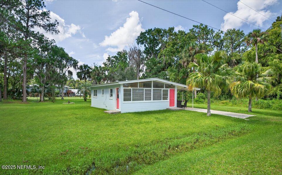 119 Ludwig Avenue Crescent City, FL 32112 - Photo 1 of 31 a view of a house with a backyard