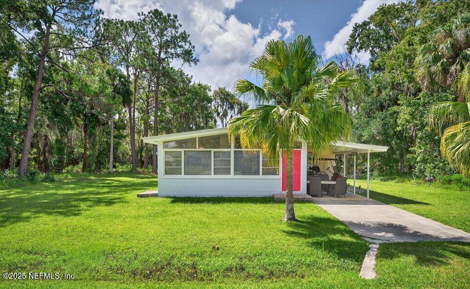 119 Ludwig Avenue Crescent City, FL 32112 - Photo 2 of 31 a front view of a house with a yard