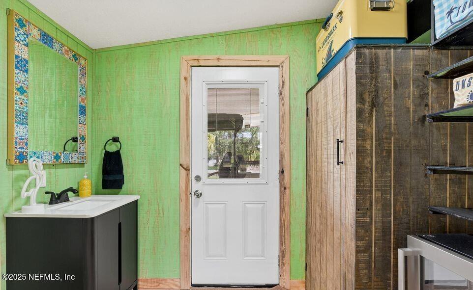 119 Ludwig Avenue Crescent City, FL 32112 - Photo 21 of 31 a bathroom with a sink and a mirror