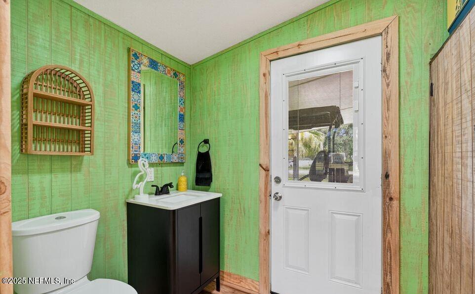 119 Ludwig Avenue Crescent City, FL 32112 - Photo 22 of 31 a bathroom with a toilet sink and mirror
