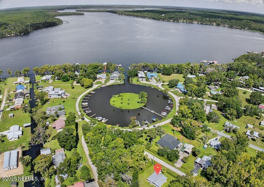 119 Ludwig Avenue Crescent City, FL 32112 - Photo 24 of 31 an aerial view of a house with a lake and trees all around