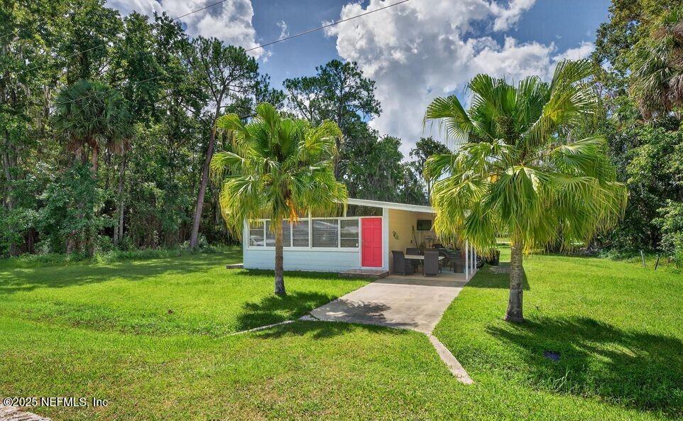 119 Ludwig Avenue Crescent City, FL 32112 - Photo 31 of 31 a front view of a house with garden