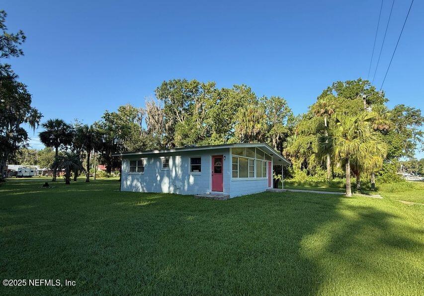 119 Ludwig Avenue Crescent City, FL 32112 - Photo 4 of 31 a front view of house with a garden