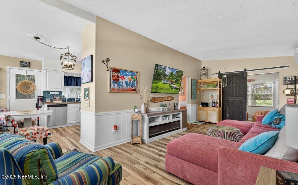 119 Ludwig Avenue Crescent City, FL 32112 - Photo 7 of 31 a living room with furniture and a flat screen tv