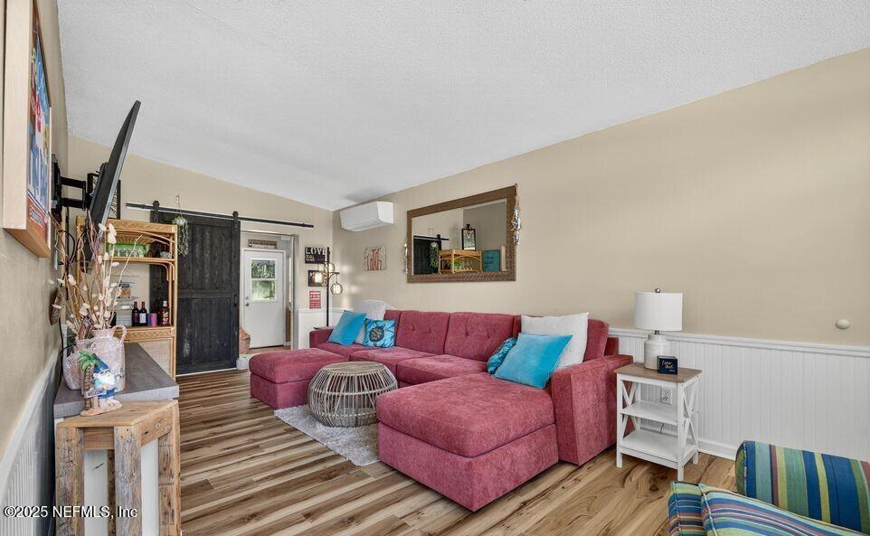 119 Ludwig Avenue Crescent City, FL 32112 - Photo 9 of 31 a living room with furniture and a wooden floor
