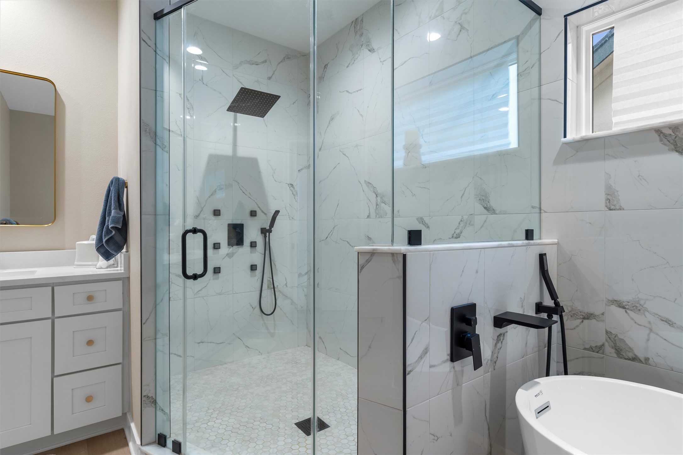307 Hurst Creek Road Austin, TX 78734 - Photo 20 of 40 Spacious shower enclosure with clear glass panels, matte black fixtures, and a rain shower head