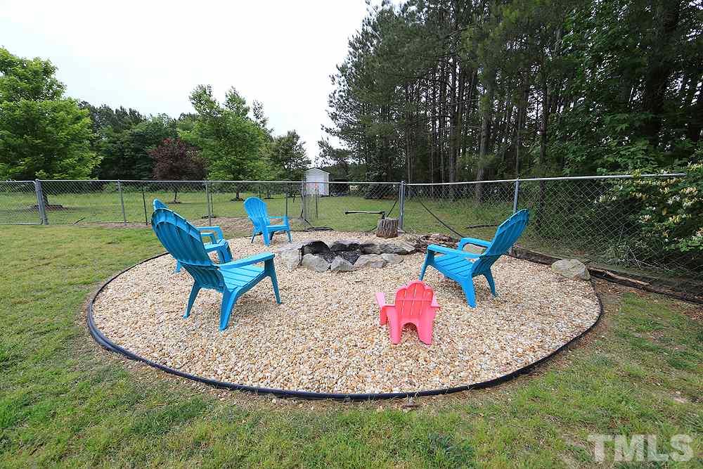 706 Perry Curtis Road Zebulon, NC 27597 - Photo 17 of 19 New fire pit ready for all your family enjoyment