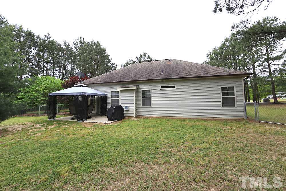 706 Perry Curtis Road Zebulon, NC 27597 - Photo 19 of 19 Nice view of the back of the house along with the amazing patio