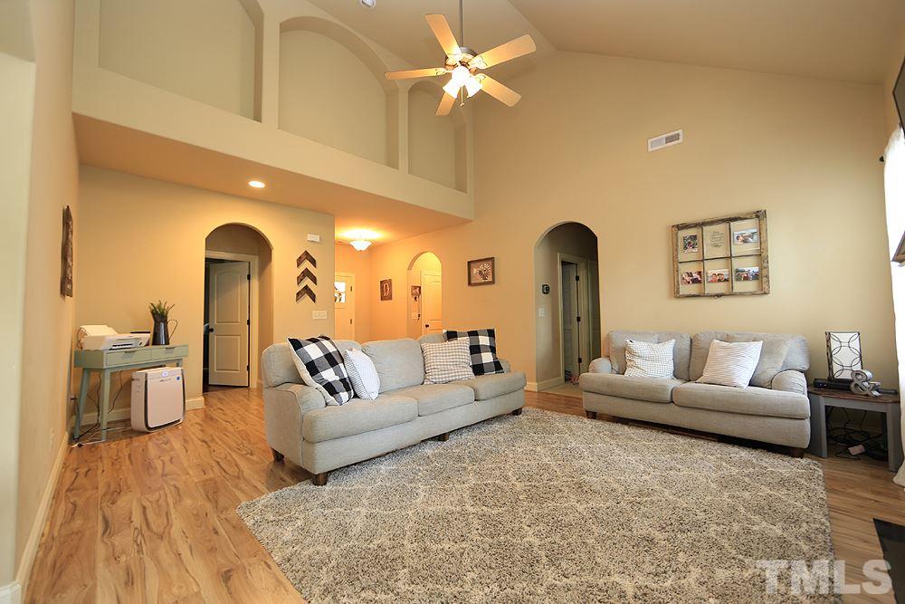 Large family room with new Pergo Flooring, fireplace, and so much more