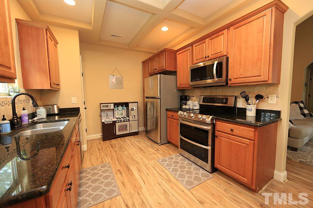 Granite Counter, Tile back splash, SS Appliance including a double oven