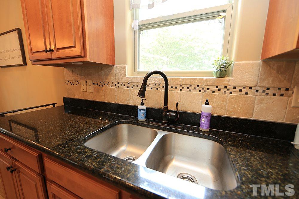 706 Perry Curtis Road Zebulon, NC 27597 - Photo 9 of 19 Large sink surrounded by granite and tile