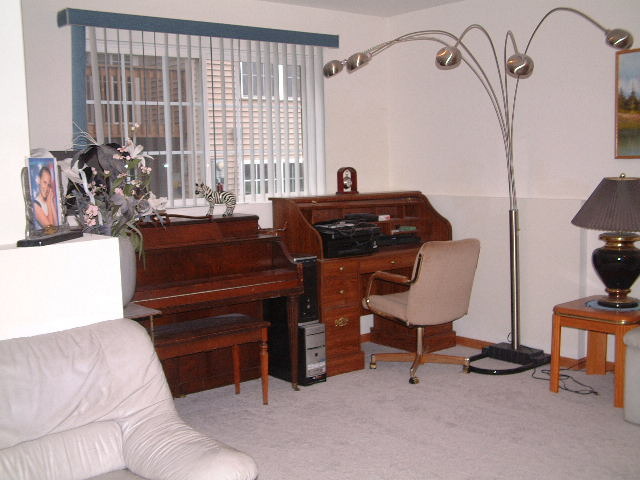 550 South Peace Road, Unit 550 Sycamore, IL 60178 - Photo 11 of 12 a bed room with a bed and a chair