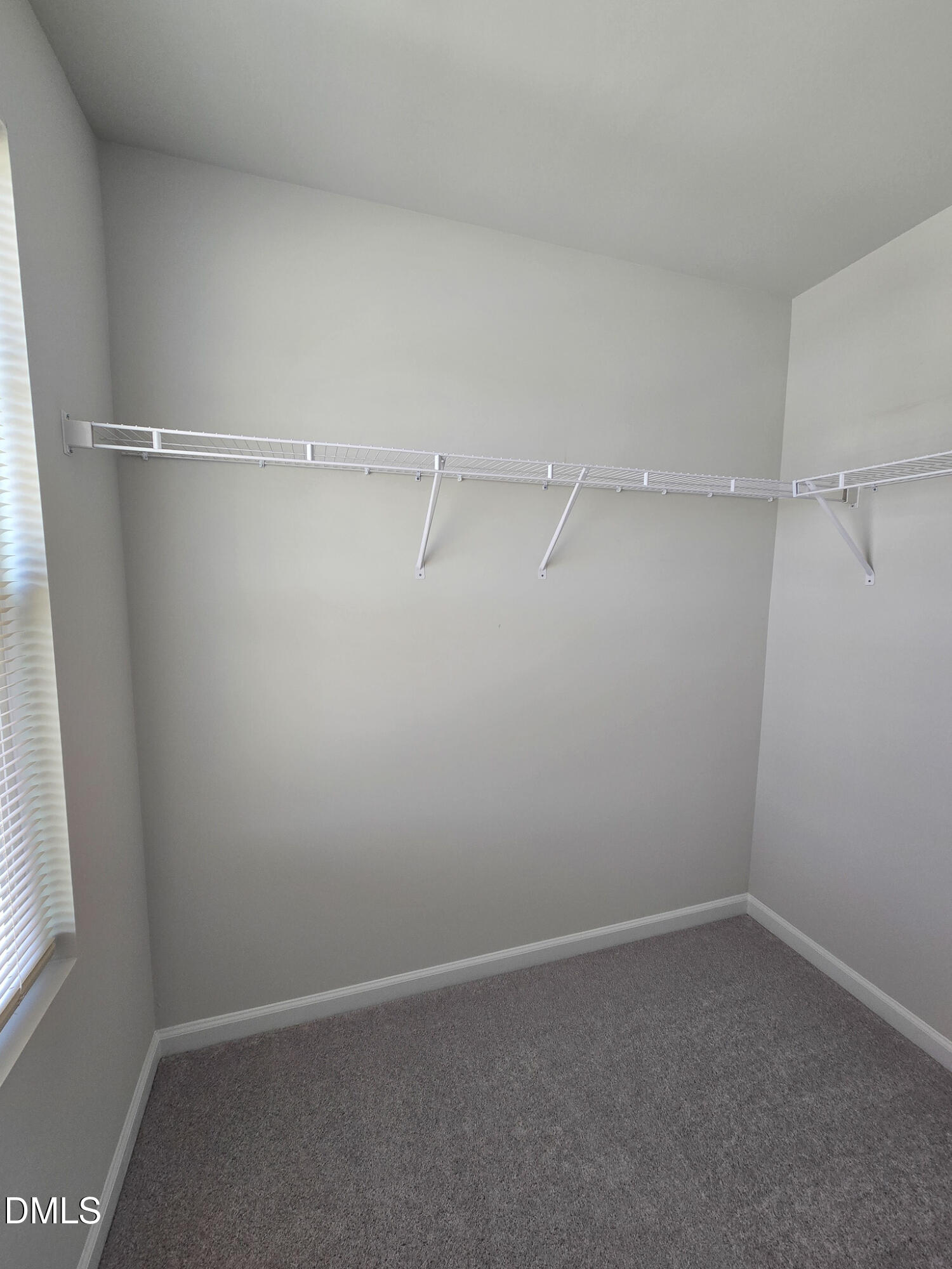 2431 Kasota Lane Raleigh, NC 27610 - Photo 40 of 46 a view of an empty walk in closet