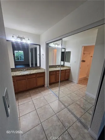 a kitchen with stainless steel appliances a stove a sink and a refrigerator