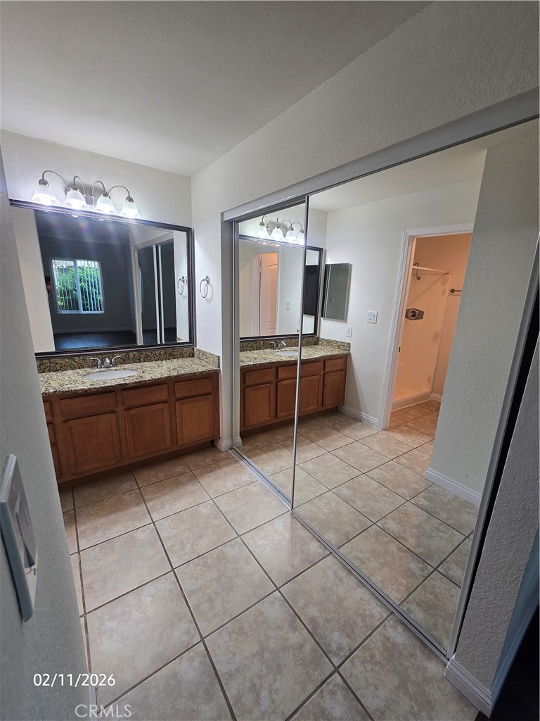 1345 Cabrillo Park, Unit R03 Santa Ana, CA 92701 - Photo 18 of 21 a kitchen with stainless steel appliances a stove a sink and a refrigerator