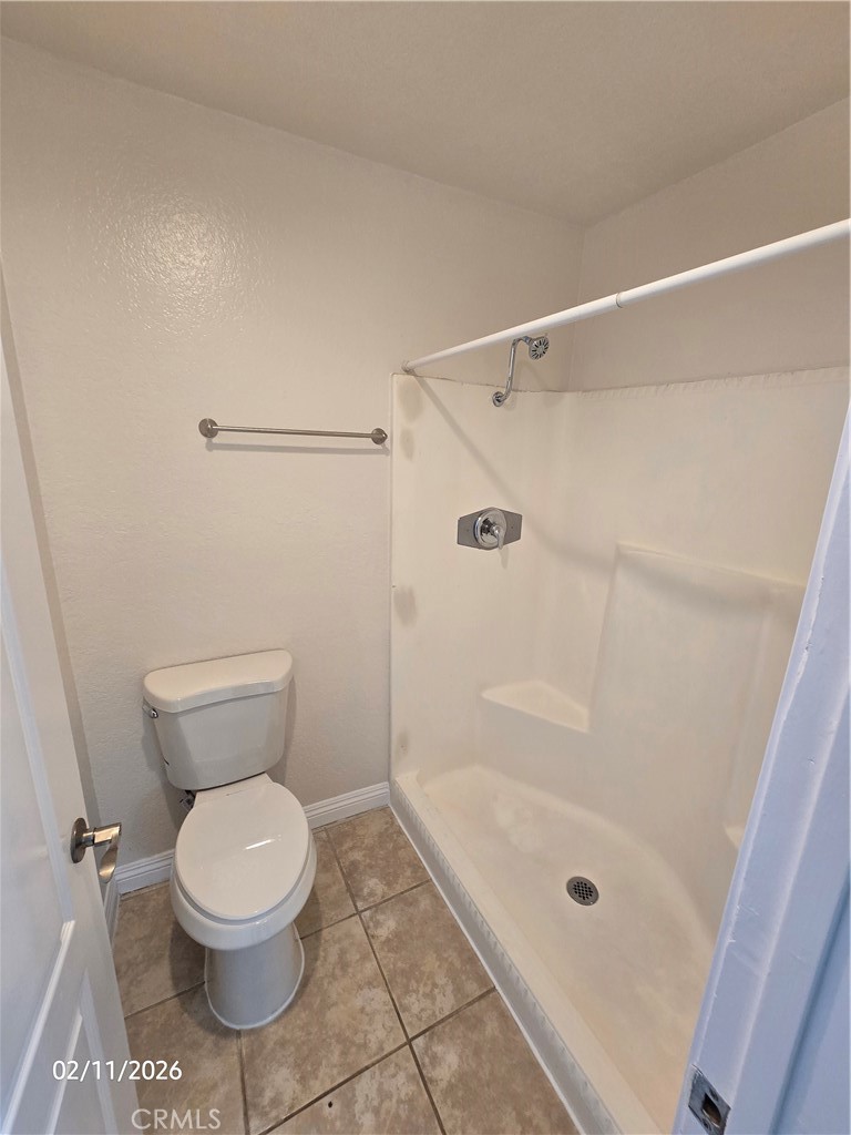 1345 Cabrillo Park, Unit R03 Santa Ana, CA 92701 - Photo 20 of 21 a bathroom with a toilet and a shower