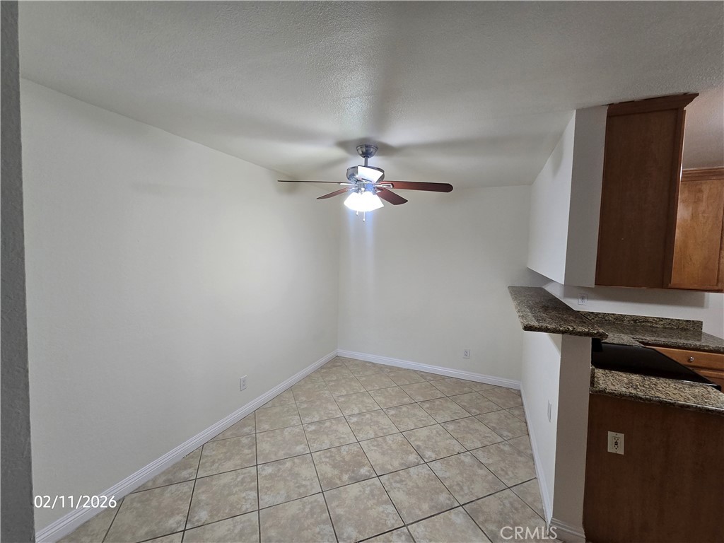 1345 Cabrillo Park, Unit R03 Santa Ana, CA 92701 - Photo 4 of 21 a view of a livingroom with a sink and a mirror