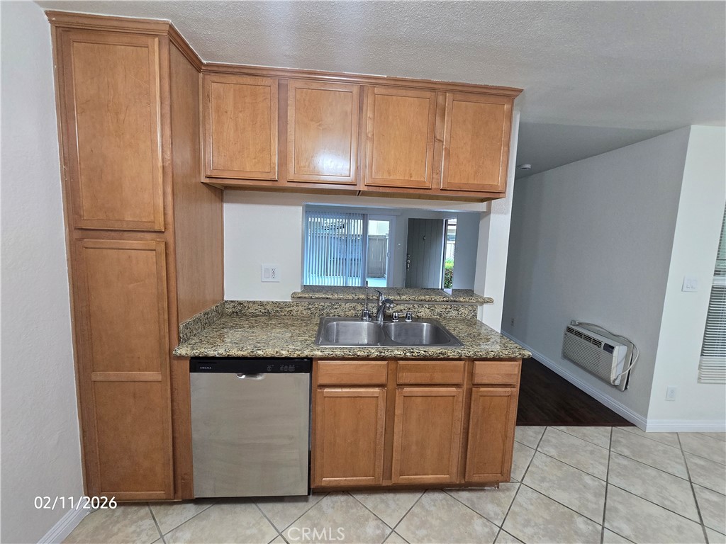1345 Cabrillo Park, Unit R03 Santa Ana, CA 92701 - Photo 8 of 21 a kitchen with a stove top oven and cabinets