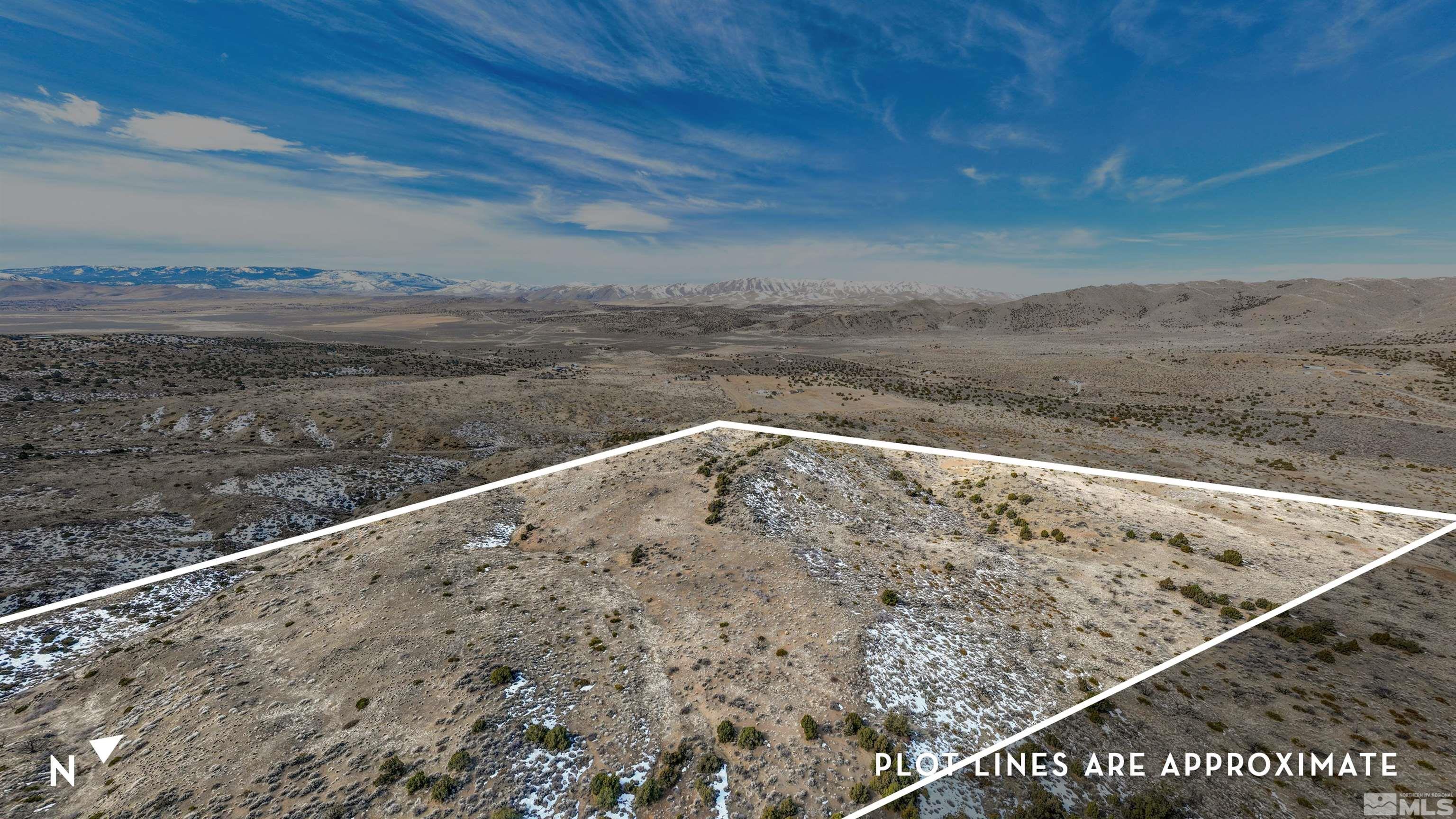 125 Oregon Hills Lane Reno, NV 89506 - Photo 19 of 32 a view of a dry yard with wooden fence