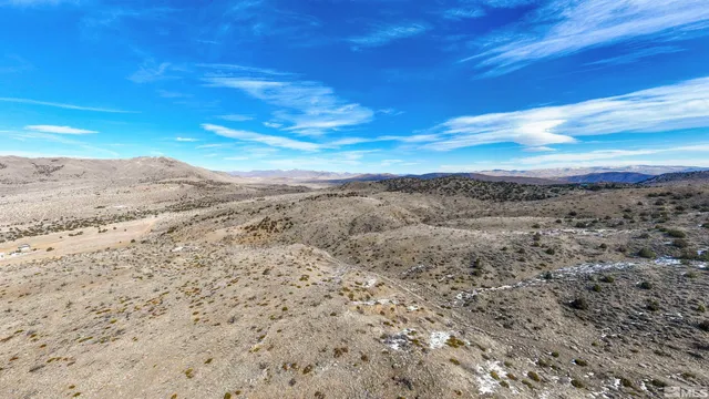 a view of a large body of water with a building in the background