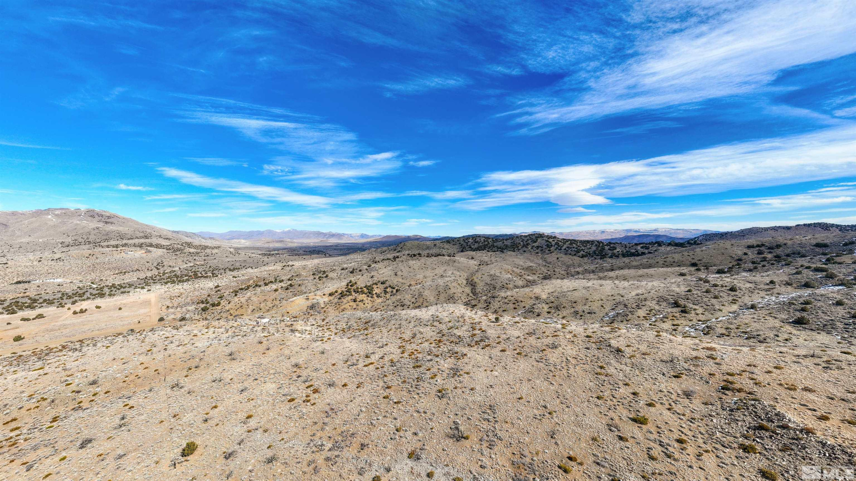 125 Oregon Hills Lane Reno, NV 89506 - Photo 28 of 32 a view of a large body of water with a building in the background