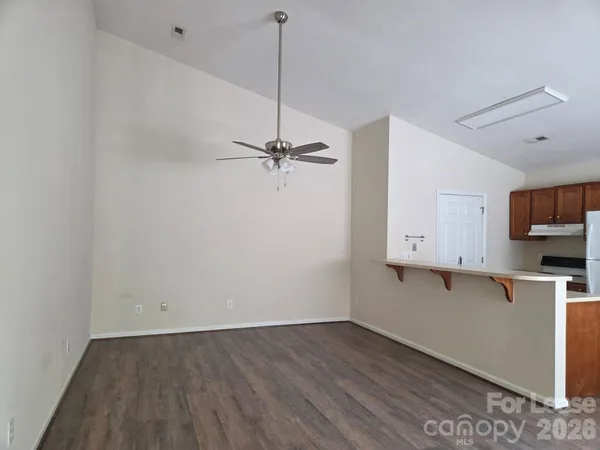 a view of cabinets and wooden floor