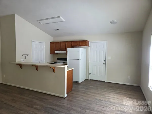 a view of kitchen with wooden floor