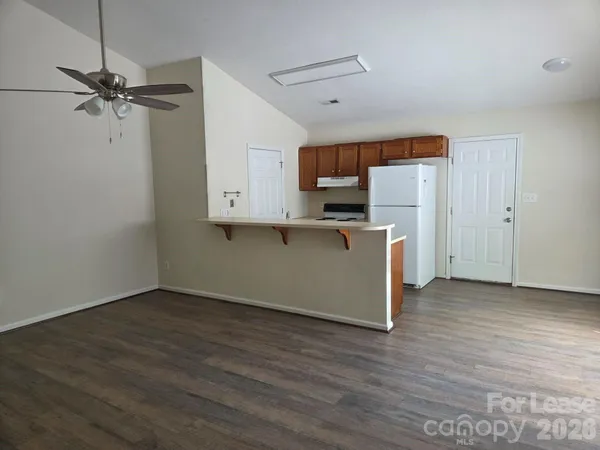 a view of kitchen with wooden floor