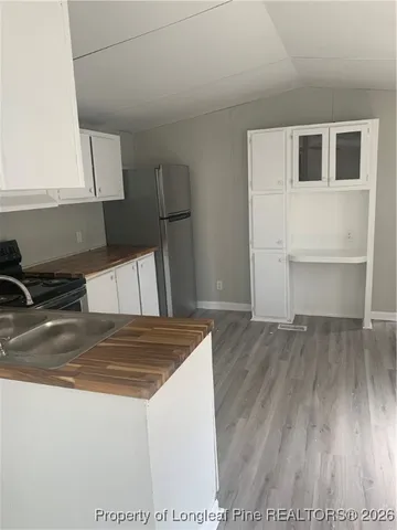 a view of kitchen with wooden floor