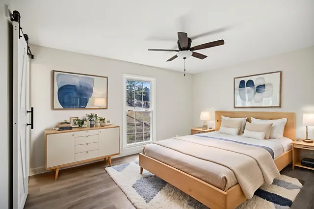 a bedroom with a bed and a desk