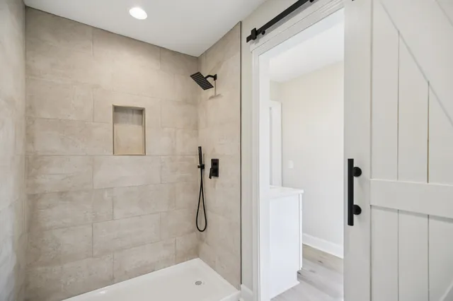 a bathroom with a glass shower door