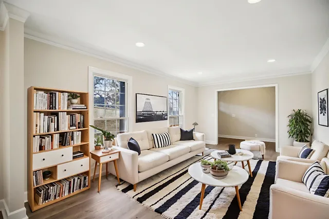 a living room with furniture and a table
