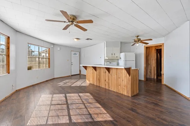 a view of kitchen with furniture and wooden floor