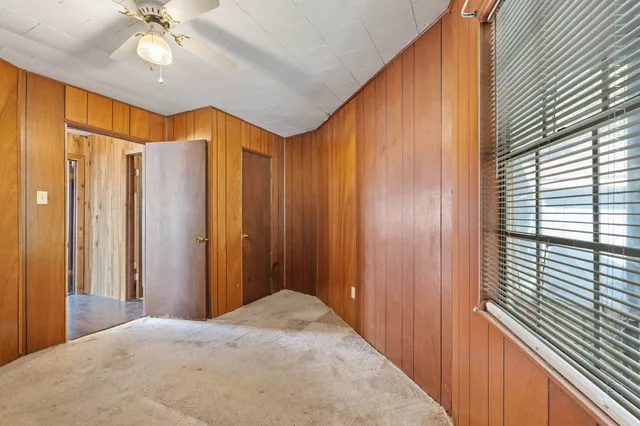 a view of a bathroom with a bathtub and shower