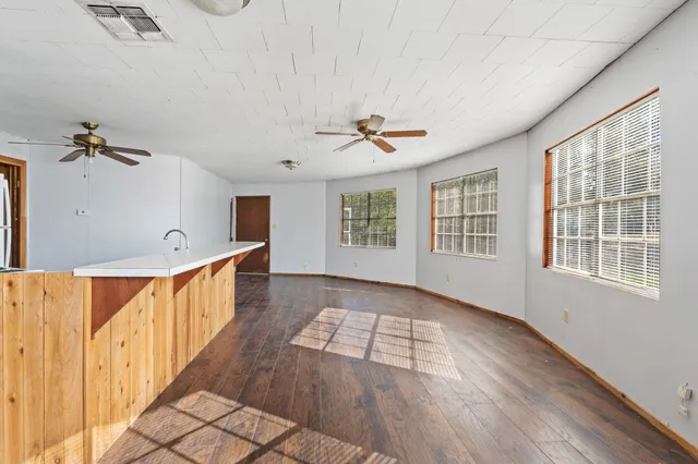 a view of an entryway with wooden floor